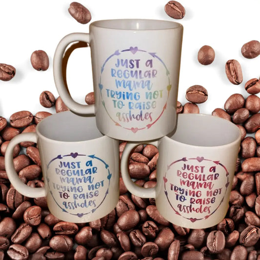 Just a regular mama trying not to raise assholes mug - Drinkware